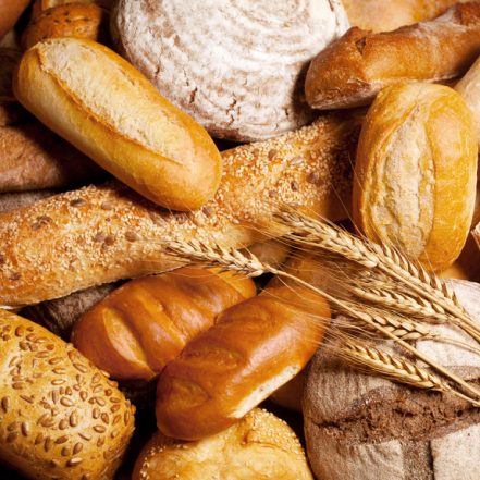 assortment of baked bread with wheat